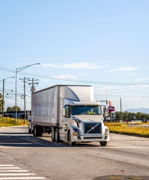 Representative commercial straight box truck on a roadway